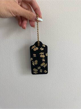 Coach Black Leather Cherry Hang Tag with Gold Hardware